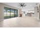 Bright open living room, tile floors, leading into the kitchen at 12409 Wigeon Dr, Bradenton, FL 34212