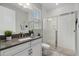 Bright bathroom featuring a modern vanity, a glass-enclosed shower, and contemporary fixtures at 2028 Woodleaf Hammock Ct, Bradenton, FL 34211