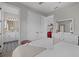 Spacious main bedroom with ensuite bathroom and view to a red decorated bonus room at 2028 Woodleaf Hammock Ct, Bradenton, FL 34211