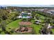 A well-maintained community playground featuring swings, slides, and picnic areas for residents to enjoy at 2028 Woodleaf Hammock Ct, Bradenton, FL 34211