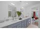 Bright bathroom with double vanity, quartz countertops, and modern fixtures at 203 72Nd St, Holmes Beach, FL 34217