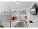 bedroom with cozy bunk beds and a contemporary design with unique zebra rug at 203 72Nd St, Holmes Beach, FL 34217
