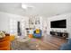 Bright living room with modern décor, including a built-in bookshelf and comfortable seating at 203 72Nd St, Holmes Beach, FL 34217