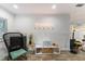 Stylish living room with modern decor, a unique light fixture, and a cozy seating area at 203 72Nd St, Holmes Beach, FL 34217