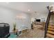 Bright and airy living room featuring modern decor, hardwood floors, and staircase at 203 72Nd St, Holmes Beach, FL 34217