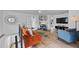 Modern living area with a stylish layout, incorporating a tv, shelving, and a vibrant color scheme at 203 72Nd St, Holmes Beach, FL 34217