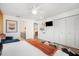 Open main bedroom with seating area, ensuite bathroom, and bright, airy atmosphere at 203 72Nd St, Holmes Beach, FL 34217
