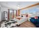 Stylish main bedroom featuring a balcony, platform bed, and modern decor at 203 72Nd St, Holmes Beach, FL 34217