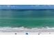 Beautiful aerial view of a sandy beach with clear blue water at 2601 Gulf N Dr # S2, Bradenton Beach, FL 34217