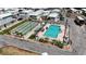 Aerial view of a community pool, shuffleboard, and recreation area at 2601 Gulf N Dr # S2, Bradenton Beach, FL 34217