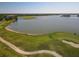 Aerial view showcasing the lake and golf course, offering a serene and picturesque environment at 6310 Watercrest Way # 201, Lakewood Ranch, FL 34202