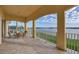 Spacious balcony offers comfortable seating and an expansive view of the tranquil lake at 6310 Watercrest Way # 201, Lakewood Ranch, FL 34202