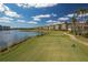 Lakeside golf course featuring multiple condos, lush greens, and beautiful landscaping at 6310 Watercrest Way # 201, Lakewood Ranch, FL 34202