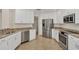 Modern kitchen featuring stainless steel appliances, light granite countertops and tile flooring at 6310 Watercrest Way # 201, Lakewood Ranch, FL 34202