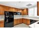 Well-equipped kitchen with black appliances and ample counter space at 6310 Watercrest Way # 201, Lakewood Ranch, FL 34202