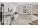 Updated kitchen with stainless steel appliances, granite countertops, and ample white cabinet storage at 6310 Watercrest Way # 201, Lakewood Ranch, FL 34202