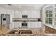 Spacious kitchen with granite countertops, stainless steel appliances, and white cabinets at 6310 Watercrest Way # 201, Lakewood Ranch, FL 34202