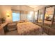 Comfortable bedroom featuring a double bed and closet space, enhanced by warm lighting and pleasant decor at 3333 26Th E Ave # 1219, Bradenton, FL 34208