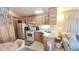 Well-equipped kitchen with modern appliances, ample counter space, and cozy dining area at 3333 26Th E Ave # 1219, Bradenton, FL 34208