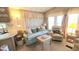 Comfortable living room, bright natural lighting, cozy sofa and armchair at 3333 26Th E Ave # 1219, Bradenton, FL 34208