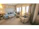 Inviting living room boasting bright natural lighting, a comfy sofa, and two armchairs at 3333 26Th E Ave # 1219, Bradenton, FL 34208
