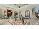 Open-concept living space with marble floors and seamless flow at 3625 Casey Key Rd, Nokomis, FL 34275