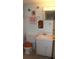 Bathroom with wooden accents, including the toilet seat and decorative butterfly pieces at 3682 Lake Bayshore Dr # K402, Bradenton, FL 34205
