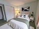 Bedroom with a queen bed, neutral walls, and minimalistic décor at 3682 Lake Bayshore Dr # K402, Bradenton, FL 34205