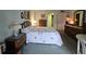 Cozy bedroom featuring a classic wood dresser, soft bedspread and side tables at 3682 Lake Bayshore Dr # K402, Bradenton, FL 34205