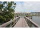 Scenic view of a dock extending into a lake, with a building visible in the background at 3682 Lake Bayshore Dr # K402, Bradenton, FL 34205