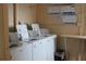 Shared laundry room with multiple washing machines and informational posters at 3682 Lake Bayshore Dr # K402, Bradenton, FL 34205
