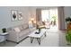 Inviting living room features neutral tones, stylish furniture, and sliding glass doors to the lanai at 3682 Lake Bayshore Dr # K402, Bradenton, FL 34205