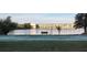 Enjoy a game of shuffleboard with a picturesque backdrop of the community lake and condominium buildings at 3682 Lake Bayshore Dr # K402, Bradenton, FL 34205