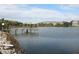 Scenic waterfront view featuring a dock and seating area, perfect for enjoying the tranquil surroundings near the community at 3682 Lake Bayshore Dr # K402, Bradenton, FL 34205