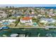 Waterfront home with red tile roof, pool, private dock, and gulf access in residential neighborhood at 550 Yardarm Ln, Longboat Key, FL 34228