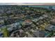 Aerial view of waterfront neighborhood with palm trees and luxurious houses at 550 Yardarm Ln, Longboat Key, FL 34228