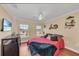 Bedroom featuring hard wood floors, ceiling fan, and furniture at 550 Yardarm Ln, Longboat Key, FL 34228