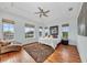 Serene bedroom with hardwood floors, lots of natural light, and neutral decor at 550 Yardarm Ln, Longboat Key, FL 34228