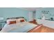 Comfortable bedroom with ample natural light, modern decor, and light blue walls at 550 Yardarm Ln, Longboat Key, FL 34228