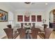 Elegant dining room featuring a modern chandelier, seating for ten, and stylish decor at 550 Yardarm Ln, Longboat Key, FL 34228