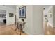 Spacious foyer features tile flooring, an ornate table, and artwork at 550 Yardarm Ln, Longboat Key, FL 34228