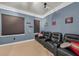 Dedicated home theater room with comfortable seating and a projector at 550 Yardarm Ln, Longboat Key, FL 34228