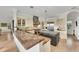 Spacious kitchen featuring granite countertops, custom cabinetry, and a large center island with stainless appliances at 550 Yardarm Ln, Longboat Key, FL 34228