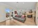 Inviting living room featuring access to an outdoor patio, tile flooring, and an open design at 550 Yardarm Ln, Longboat Key, FL 34228