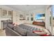 Open living room area with large windows, bar area, and ample seating at 550 Yardarm Ln, Longboat Key, FL 34228