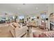 Spacious living room with ample seating and natural light at 550 Yardarm Ln, Longboat Key, FL 34228