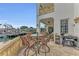 Spacious patio with outdoor seating and a barbecue grill, overlooking waterfront views at 550 Yardarm Ln, Longboat Key, FL 34228