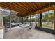 Screened patio with spiral staircase leading to pool area, offering an outdoor dining space at 631 43Rd Street W Blvd, Palmetto, FL 34221