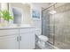 Well-lit bathroom with a glass shower, white vanity, and decorative accents at 12826 Sorrento Way, Bradenton, FL 34211