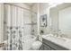 Cozy bathroom with a shower-tub combo, stylish curtain, and a gray vanity at 12826 Sorrento Way, Bradenton, FL 34211